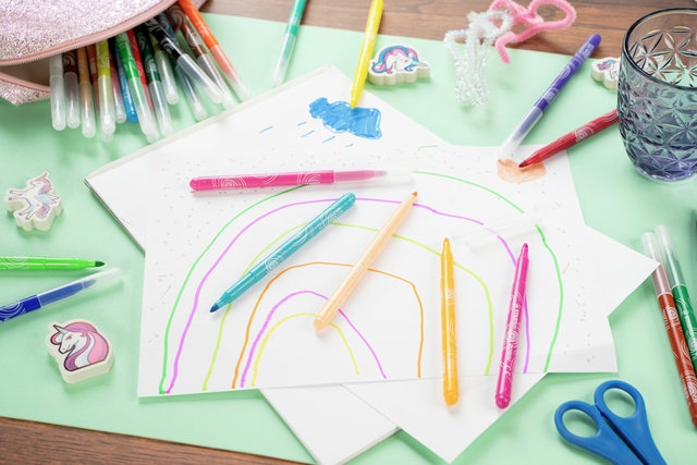 crayons, art paper, markers, scissors, rainbow drawing